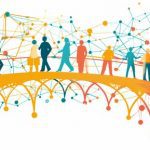 Silhouettes of people standing on a bridge.